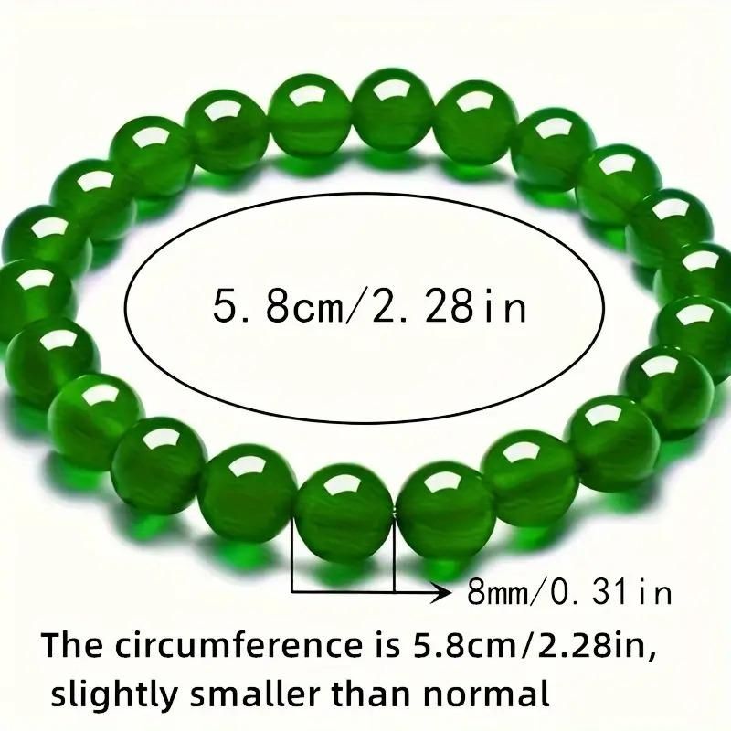 Green beaded bracelet with measurements on a white background