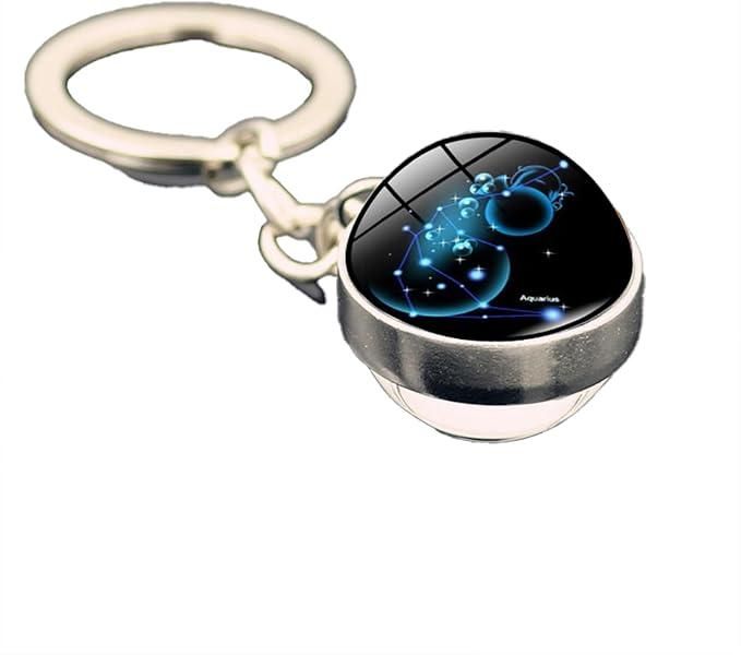 Keychain with a circular design featuring a blue astrological symbol on a black background.