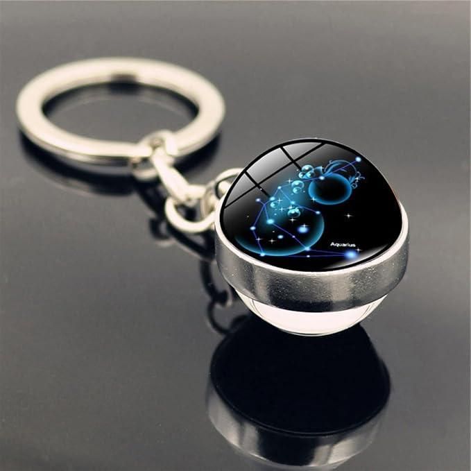 Keychain with astrological design on a reflective surface