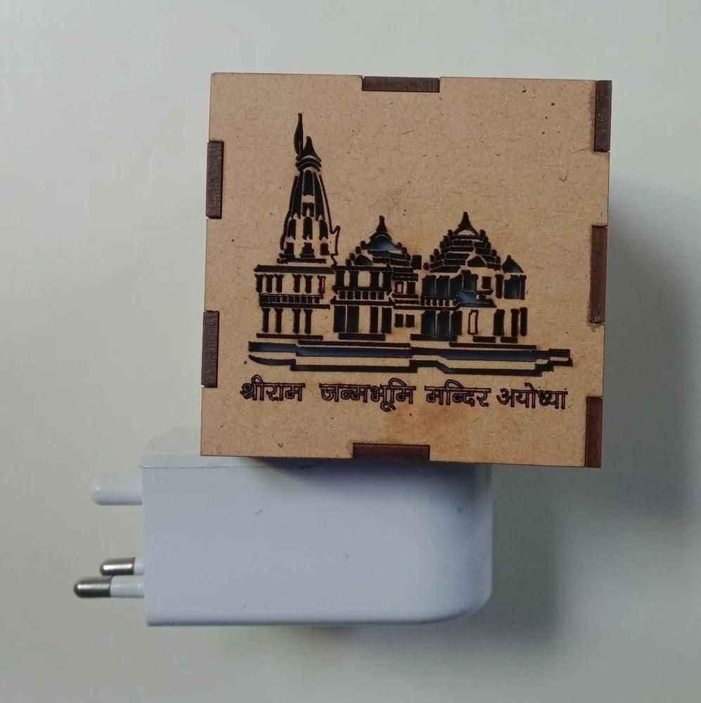 Side angle of Ram Mandir model placed in a home prayer space